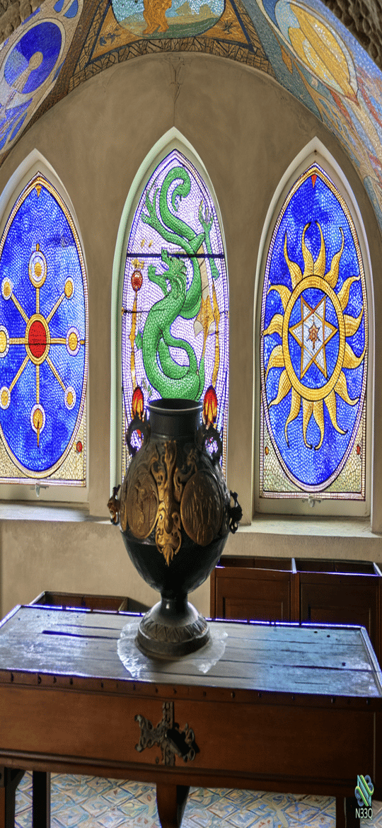 Ornate Vase Before Dragon Stained Glass