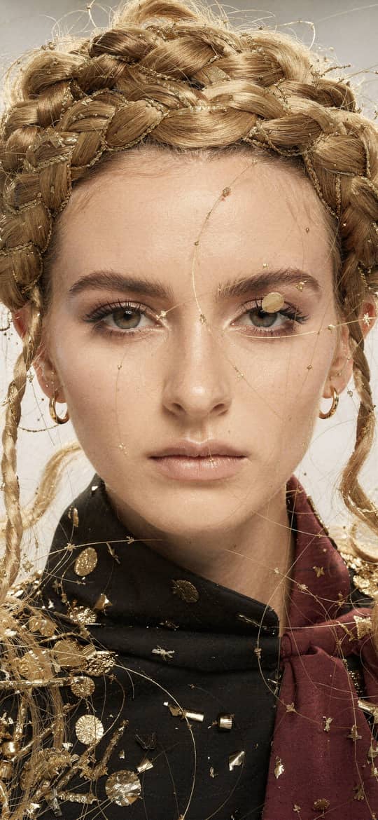Woman with Intricate Blonde Braids and Gold