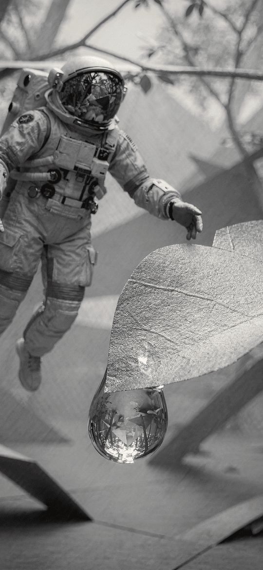 Astronaut Floating Beside a Giant Dewdrop Leaf
