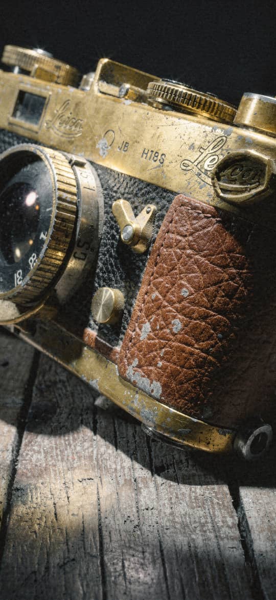 Worn Vintage Leica Camera on Wood