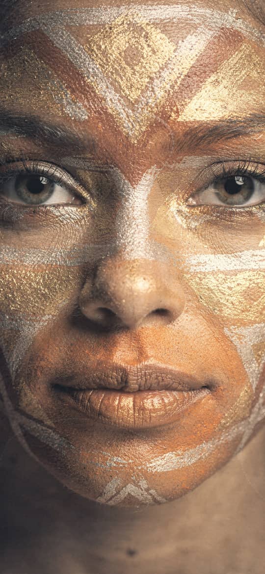 Woman with Golden Geometric Face Paint