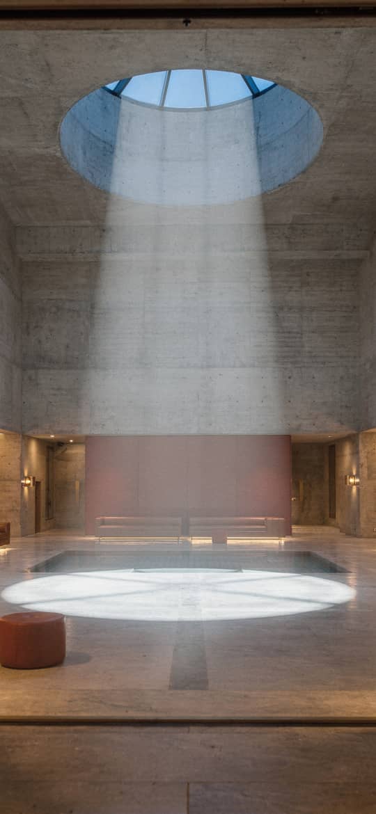 Concrete Atrium with Oculus Light Beam