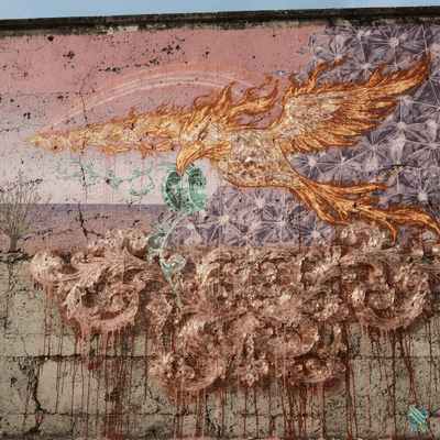 Fiery Phoenix Mural on Cracked Wall
