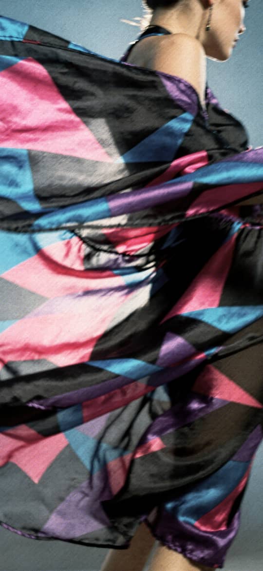Woman in Swirling Geometric Dress