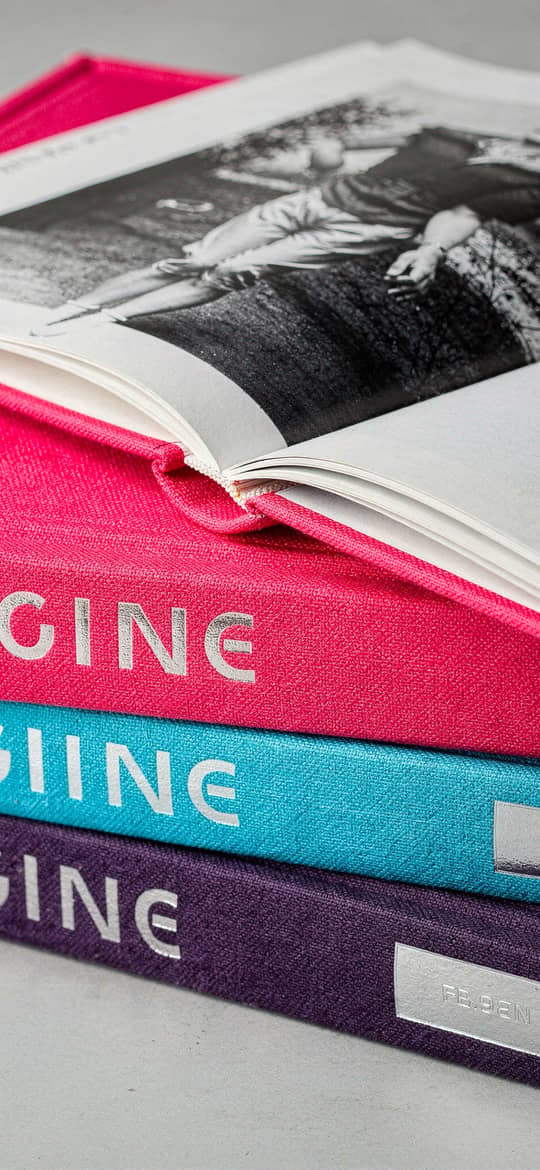 Stack of Colorful Books with Open Vintage Photo