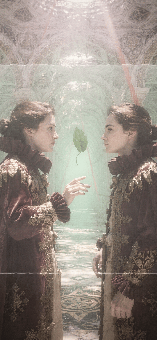 Two Women in Ornate Gowns Facing a Floating Leaf