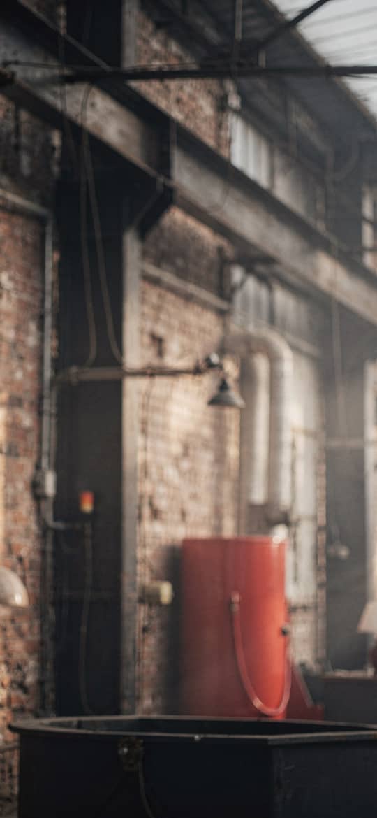 Industrial Factory Interior with Red Tank