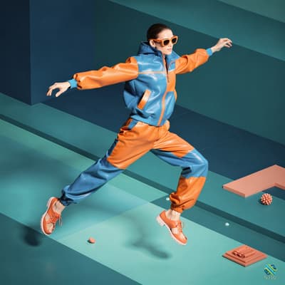 Woman Leaping in Blue Orange Tracksuit