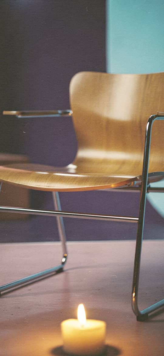 Cantilever Chair with Lit Candle