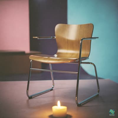 Cantilever Chair with Lit Candle
